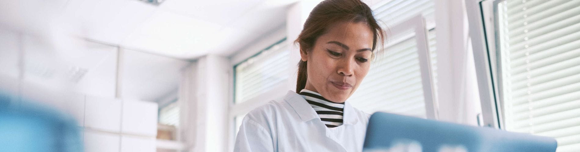 Asian scientist working in laboratory